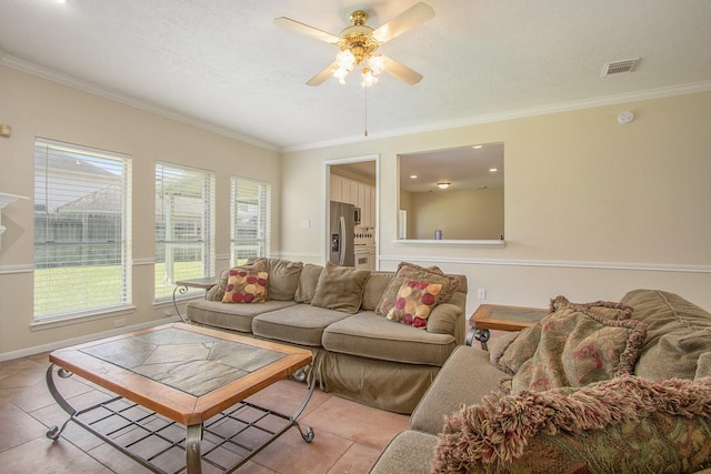 2521 Sea Horse Ct, Seabrook, TX 77586 - living room featuring ornamental molding, ceiling fan, and light tile patterned flooring