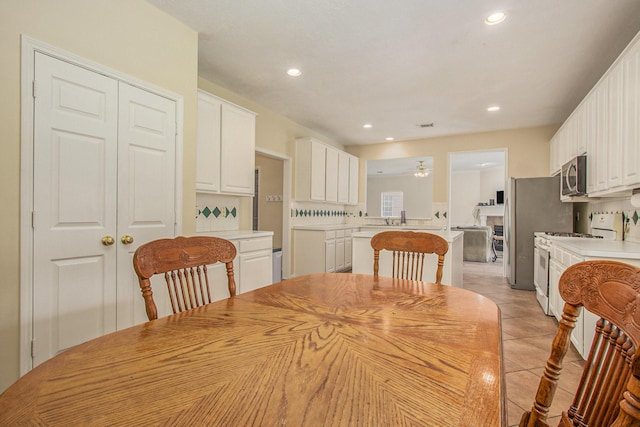 2521 Sea Horse Ct, Seabrook, TX 77586 - dining space featuring recessed lighting and light tile patterned flooring
