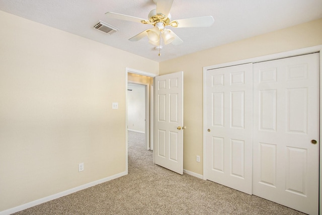 2521 Sea Horse Ct, Seabrook, TX 77586 - unfurnished bedroom featuring light carpet, a closet, and a ceiling fan