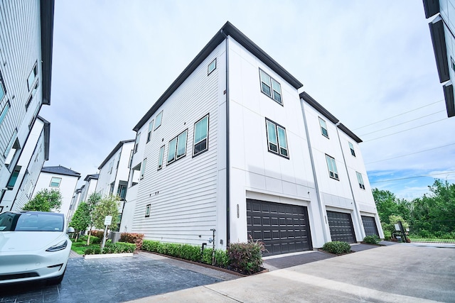 2802 Grand Fountains Dr Unit C, Houston, TX 77054 - view of property exterior with an attached garage