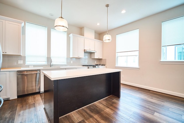 2802 Grand Fountains Dr Unit C, Houston, TX 77054 - kitchen with stainless steel dishwasher, backsplash, light countertops, white cabinets, and recessed lighting
