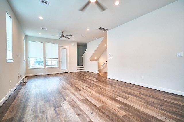 2802 Grand Fountains Dr Unit C, Houston, TX 77054 - unfurnished living room with a ceiling fan, wood finished floors, recessed lighting, and stairs