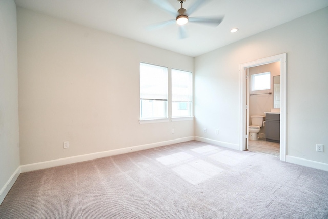 2802 Grand Fountains Dr Unit C, Houston, TX 77054 - unfurnished bedroom featuring multiple windows, light carpet, ensuite bathroom, recessed lighting, and a ceiling fan