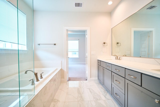 2802 Grand Fountains Dr Unit C, Houston, TX 77054 - full bath featuring a garden tub, double vanity, and marble look tile flooring