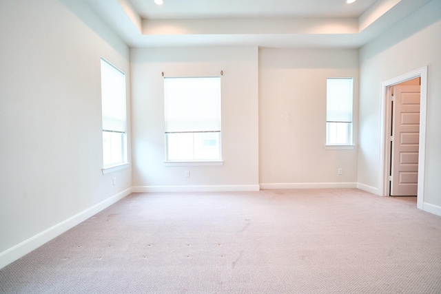 2802 Grand Fountains Dr Unit C, Houston, TX 77054 - empty room featuring a tray ceiling, light colored carpet, and recessed lighting