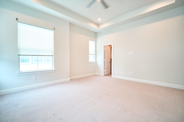 2802 Grand Fountains Dr Unit C, Houston, TX 77054 - spare room featuring ceiling fan, light colored carpet, plenty of natural light, recessed lighting, and a raised ceiling