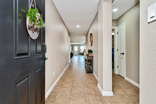10515 Kentington Oak Dr, Humble, TX 77396 - hallway featuring light tile patterned flooring and recessed lighting