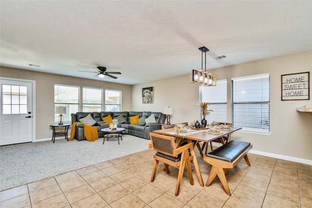 10515 Kentington Oak Dr, Humble, TX 77396 - dining space with light tile patterned flooring, light carpet, and a ceiling fan