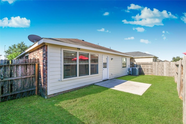 10515 Kentington Oak Dr, Humble, TX 77396 - back of property featuring a fenced backyard, a patio, and brick siding