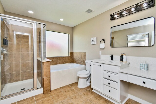 10515 Kentington Oak Dr, Humble, TX 77396 - bathroom with vanity, a garden tub, a shower stall, tile patterned flooring, and recessed lighting