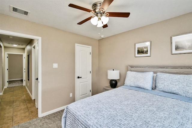 10515 Kentington Oak Dr, Humble, TX 77396 - tiled bedroom with baseboards and ceiling fan