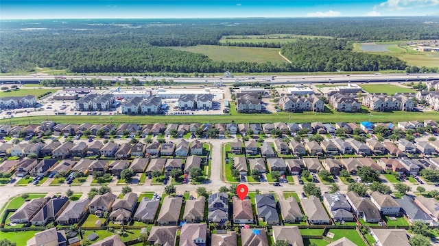 10515 Kentington Oak Dr, Humble, TX 77396 - aerial overview of property's location with nearby suburban area and a large body of water