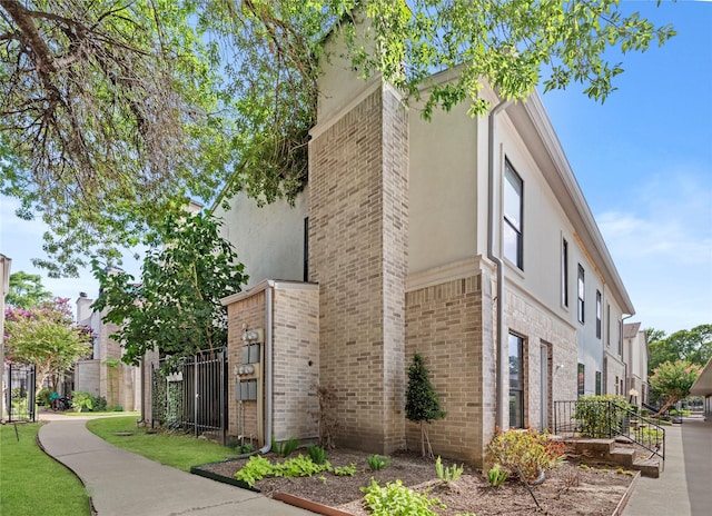 2425 Augusta Dr Unit 30, Houston, TX 77057 - view of side of property with stucco siding and brick siding
