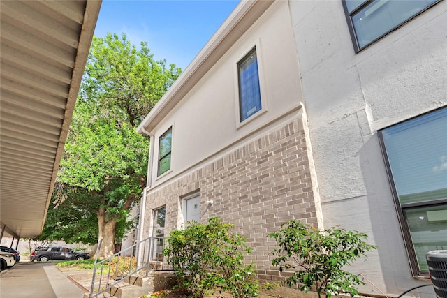 2425 Augusta Dr Unit 30, Houston, TX 77057 - view of property exterior with brick siding and stucco siding
