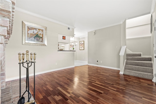 2425 Augusta Dr Unit 30, Houston, TX 77057 - unfurnished living room with stairs, wood finished floors, a chandelier, and ornamental molding