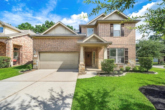 2 Painted Post Pl, Spring, TX 77389 - view of front of house featuring concrete driveway, a front yard, stone siding, and an attached garage