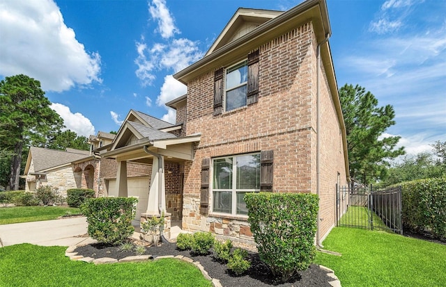 2 Painted Post Pl, Spring, TX 77389 - view of front of home featuring brick siding, a garage, and stone siding