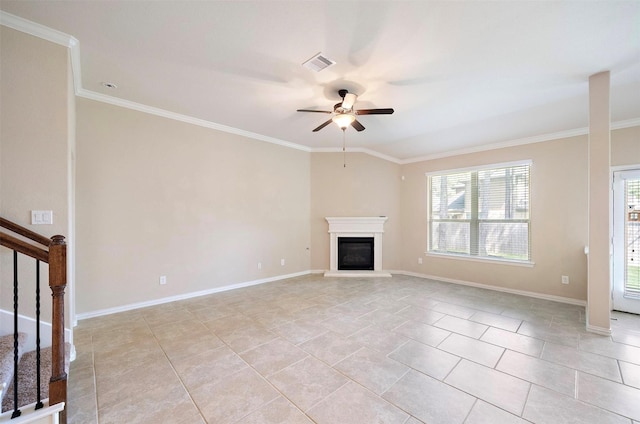 2 Painted Post Pl, Spring, TX 77389 - unfurnished living room featuring ceiling fan, crown molding, healthy amount of natural light, stairs, and a glass covered fireplace