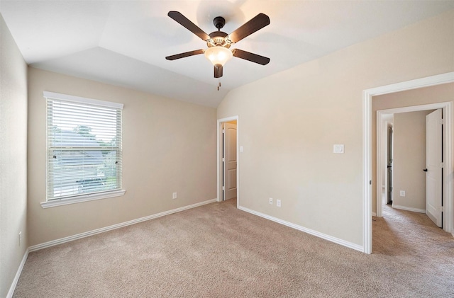 2 Painted Post Pl, Spring, TX 77389 - unfurnished bedroom with light colored carpet, lofted ceiling, and a ceiling fan