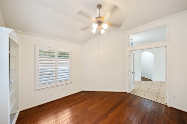 47 Dresden Pl, The Woodlands, TX 77382 - unfurnished room with ceiling fan, ornamental molding, dark wood-style flooring, and arched walkways