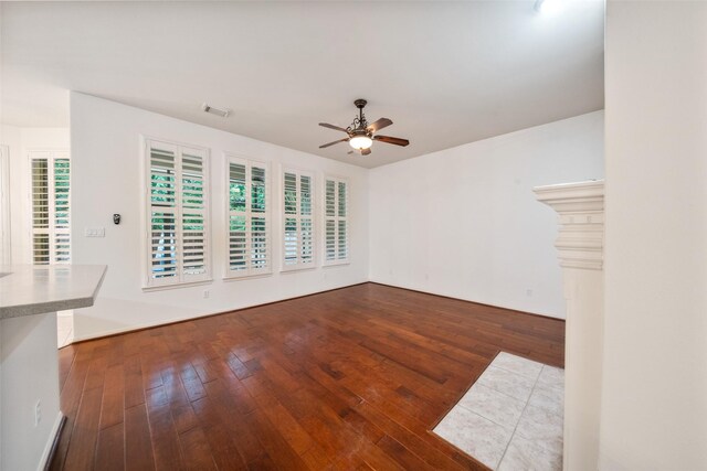 47 Dresden Pl, The Woodlands, TX 77382 - unfurnished living room with ceiling fan and hardwood / wood-style floors