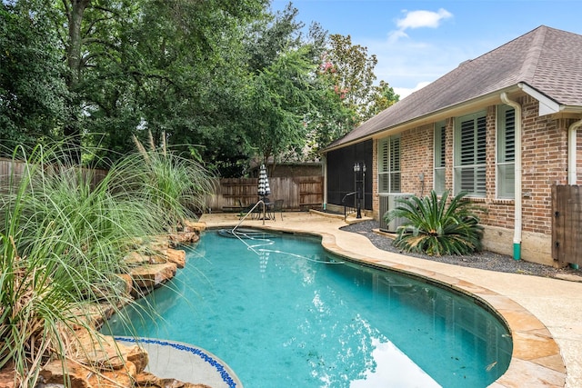 47 Dresden Pl, The Woodlands, TX 77382 - view of pool with a fenced backyard, a sunroom, and a patio area