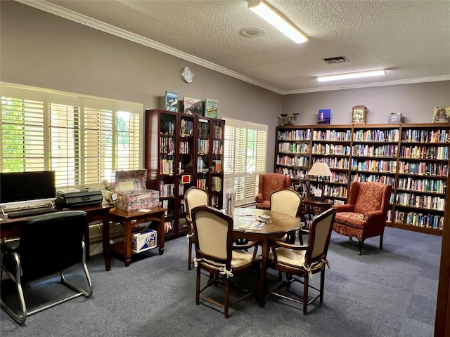 667 E Country Grove Cir, Pearland, TX 77584 - carpeted home office with bookshelves, ornamental molding, and a textured ceiling