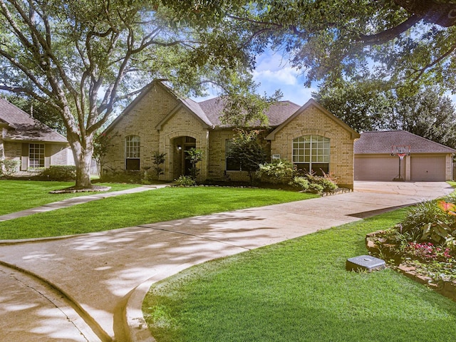 11702 Park Cedar Ct, Tomball, TX 77377 - view of front of home featuring brick siding, a front yard, driveway, and a shingled roof