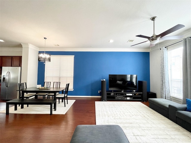 3207 Clearview Cir, Houston, TX 77025 - living room with dark wood finished floors, a chandelier, ornamental molding, ceiling fan, and recessed lighting