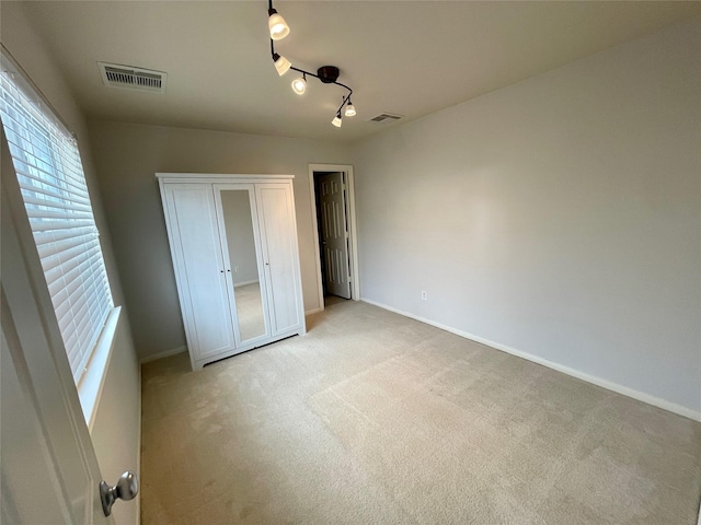 3207 Clearview Cir, Houston, TX 77025 - unfurnished bedroom with light colored carpet and a closet