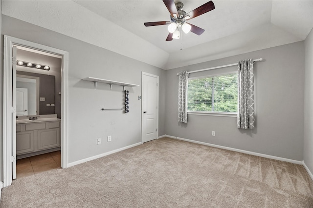 17518 Cypress Laurel St, Houston, TX 77095 - unfurnished bedroom featuring light carpet, ensuite bathroom, vaulted ceiling, and ceiling fan
