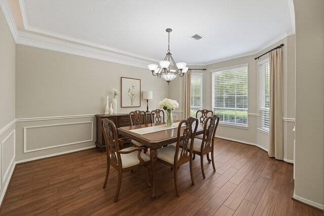 17518 Cypress Laurel St, Houston, TX 77095 - dining space with ornamental molding, a chandelier, and wood finished floors