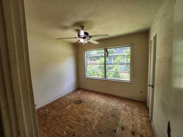 5535 Flamingo Dr, Houston, TX 77033 - spare room featuring a textured ceiling and ceiling fan
