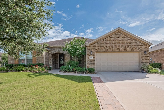 3903 Grand Fir Ct, Richmond, TX 77469 - view of front of house with brick siding, concrete driveway, and a front yard