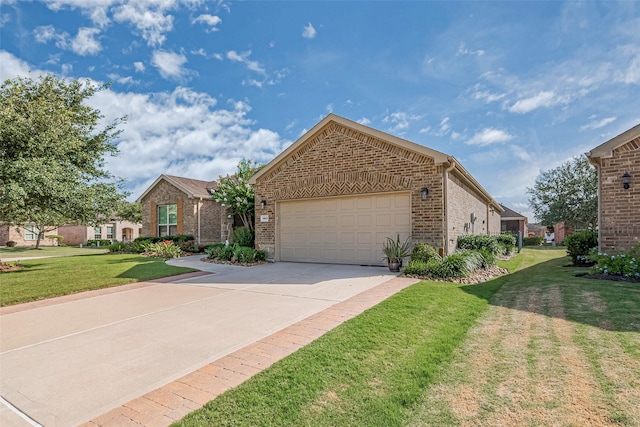 3903 Grand Fir Ct, Richmond, TX 77469 - view of front of home featuring brick siding, a garage, driveway, and a front yard