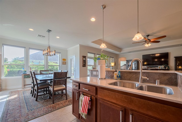 3903 Grand Fir Ct, Richmond, TX 77469 - kitchen with crown molding, pendant lighting, open floor plan, a chandelier, and a ceiling fan
