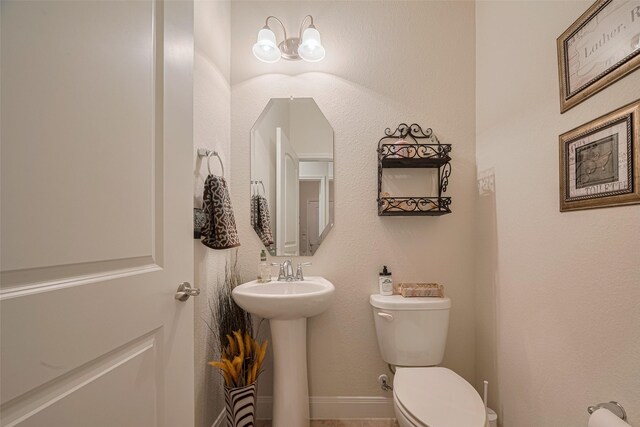 3903 Grand Fir Ct, Richmond, TX 77469 - bathroom featuring toilet and a sink