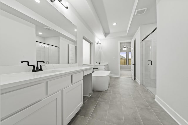 3240 Stingray Cove Dr, Katy, TX 77493 - full bathroom with vanity, a shower stall, a soaking tub, recessed lighting, and tile patterned flooring
