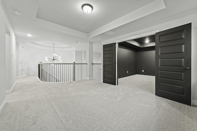 3240 Stingray Cove Dr, Katy, TX 77493 - unfurnished room with a raised ceiling, a chandelier, carpet flooring, and a smoke detector
