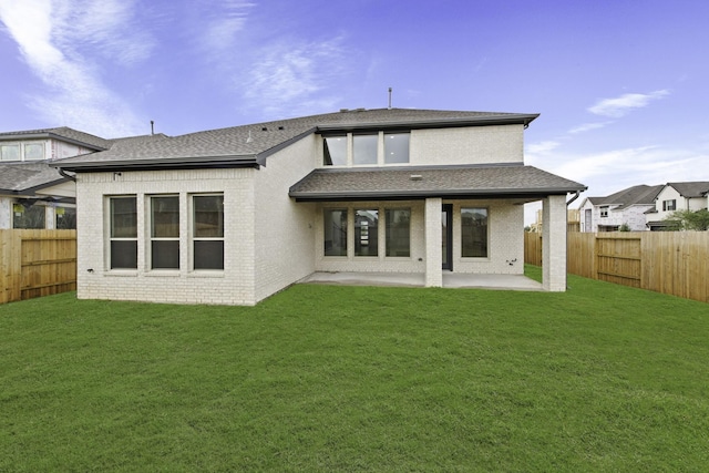 3240 Stingray Cove Dr, Katy, TX 77493 - back of house with a patio area, a fenced backyard, a shingled roof, and brick siding