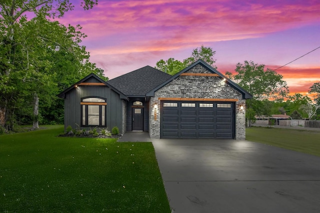 3220 Saint James Blvd, Beaumont, TX 77705 - view of front of home featuring concrete driveway, a lawn, an attached garage, and a shingled roof