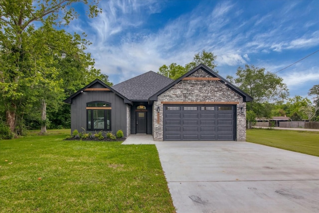 3220 Saint James Blvd, Beaumont, TX 77705 - view of front facade featuring a garage, driveway, a shingled roof, and brick siding