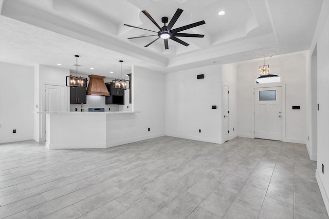 3220 Saint James Blvd, Beaumont, TX 77705 - unfurnished living room with a chandelier, recessed lighting, ceiling fan, a tray ceiling, and coffered ceiling