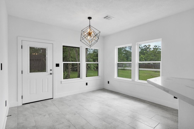 3220 Saint James Blvd, Beaumont, TX 77705 - unfurnished sunroom with a chandelier