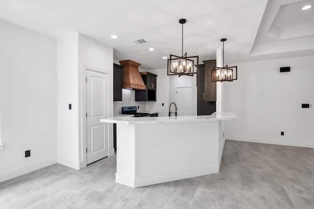 3220 Saint James Blvd, Beaumont, TX 77705 - kitchen featuring a chandelier, custom range hood, range, light countertops, and recessed lighting