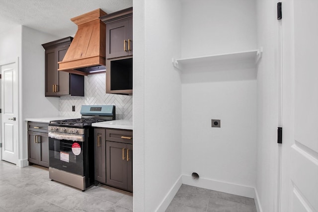 3220 Saint James Blvd, Beaumont, TX 77705 - kitchen with stainless steel gas range oven, custom range hood, backsplash, light countertops, and open shelves