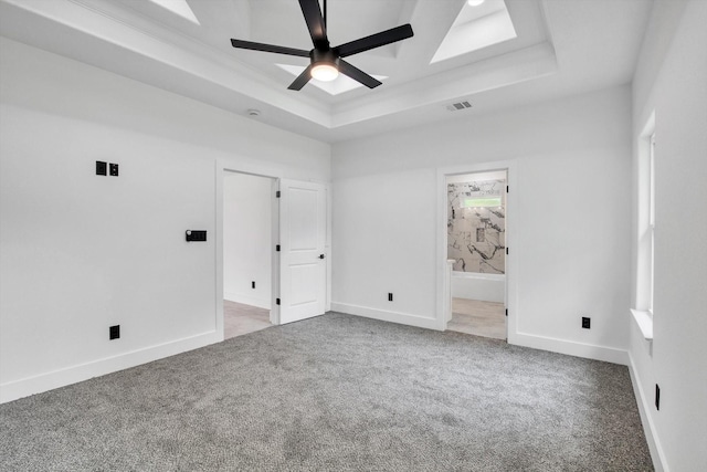 3220 Saint James Blvd, Beaumont, TX 77705 - unfurnished room with a tray ceiling, carpet floors, and ceiling fan