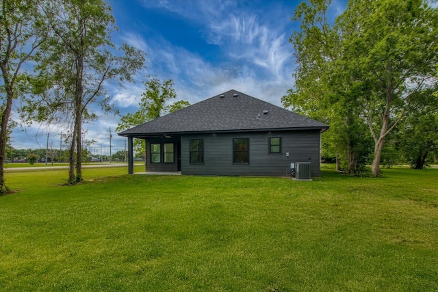 3220 Saint James Blvd, Beaumont, TX 77705 - rear view of house with a lawn and a shingled roof