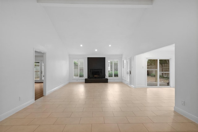 310 W Fair Harbor Ln, Houston, TX 77079 - unfurnished living room featuring high vaulted ceiling, beamed ceiling, a fireplace with raised hearth, and recessed lighting