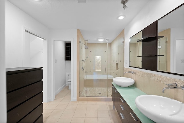 310 W Fair Harbor Ln, Houston, TX 77079 - bathroom featuring a shower stall, tile patterned flooring, and double vanity